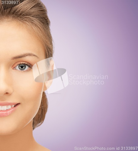 Image of close up of beautiful young woman half face