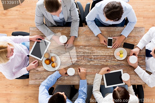 Image of close up of business team drinking coffee on lunch