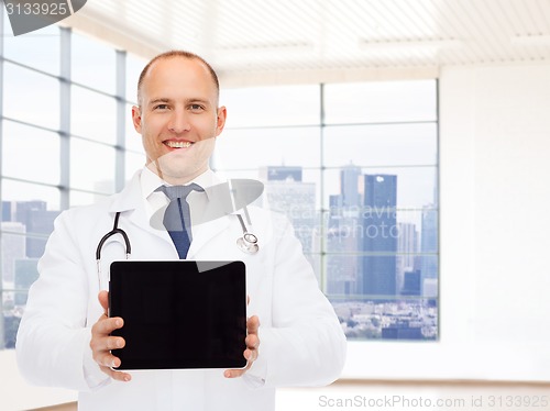 Image of smiling male doctor with tablet pc