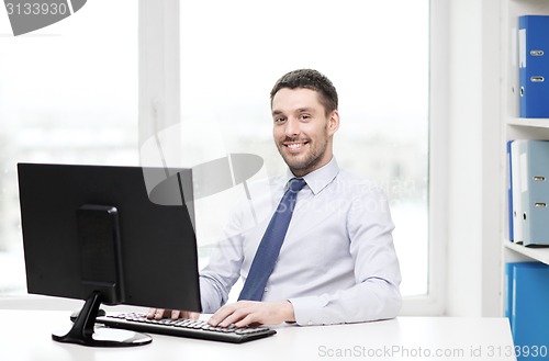 Image of smiling businessman or student with computer