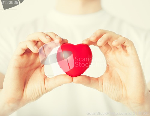 Image of man hands with heart