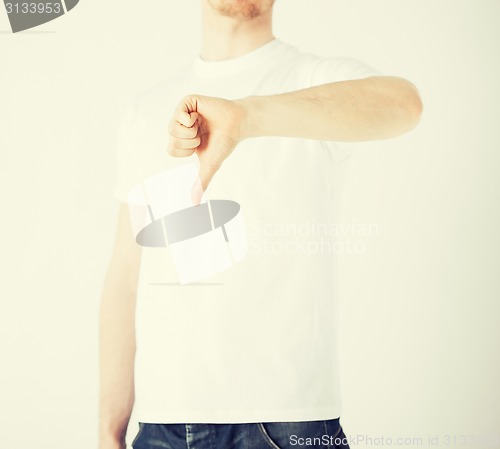 Image of man showing thumbs down