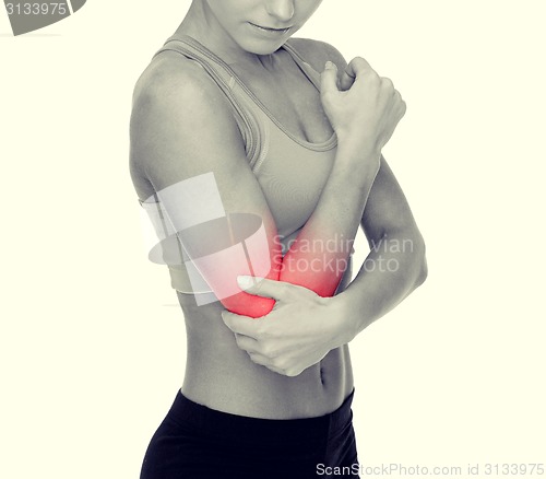 Image of sporty woman with pain in elbow