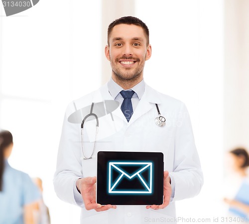 Image of smiling male doctor with tablet pc