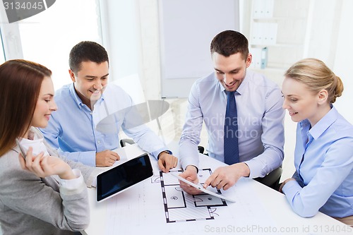 Image of smiling business people meeting in office