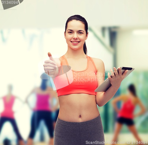 Image of sporty woman with tablet pc computer