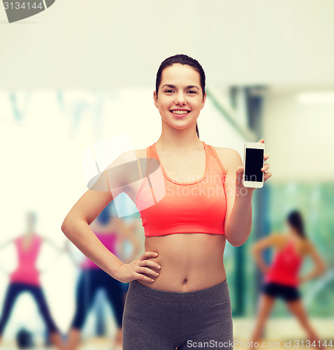 Image of sporty woman with smartphone