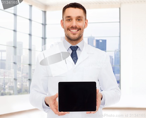 Image of smiling male doctor with tablet pc