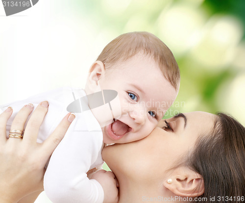 Image of laughing baby playing with mother