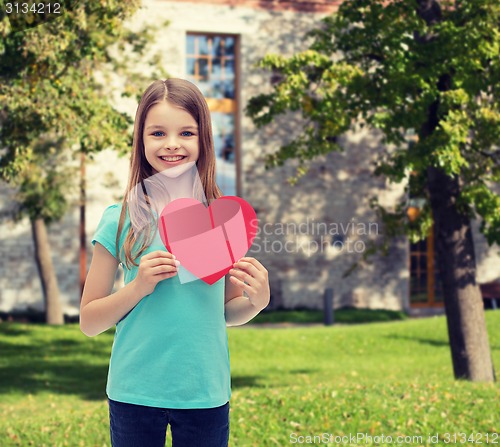 Image of smiling little girl with red heart