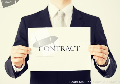 Image of man hands holding contract paper