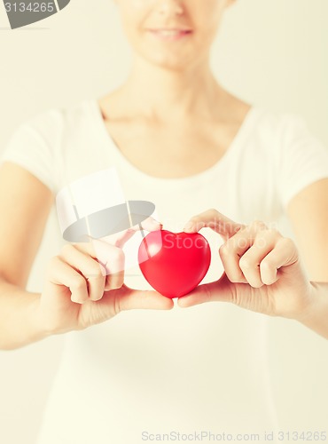 Image of woman hands with heart