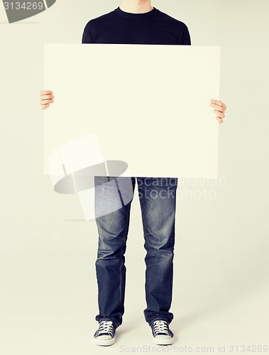 Image of man showing white blank board