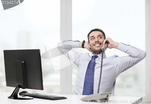 Image of smiling businessman or student with computer