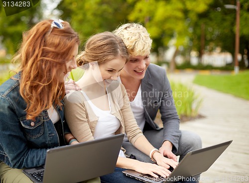 Image of students or teenagers with laptop computers