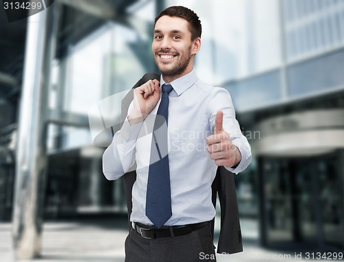 Image of handsome buisnessman with jacket over shoulder