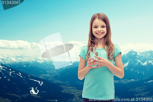 Image of smiling little girl with glass of water