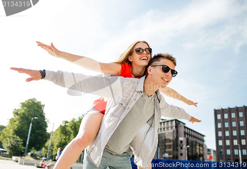 Image of smiling couple having fun in city