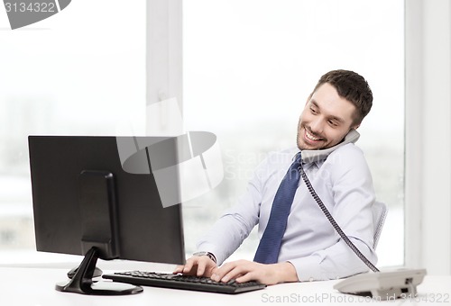 Image of smiling businessman or student with computer