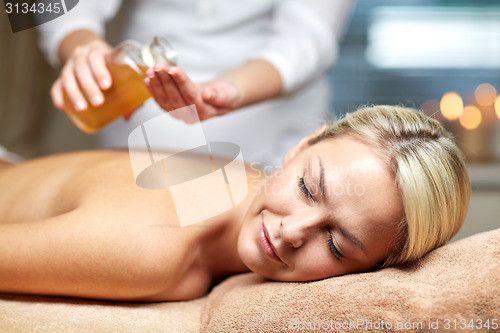 Image of close up of woman lying on massage table in spa