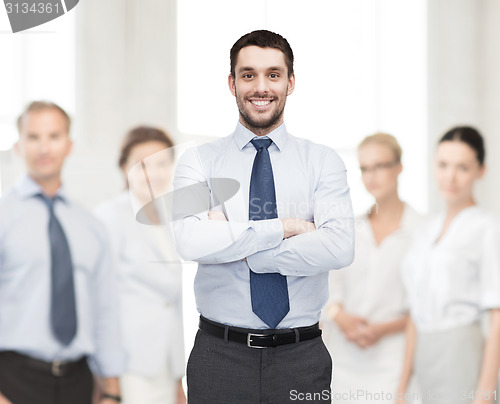 Image of handsome businessman with crossed arms