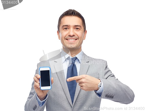 Image of happy businessman showing smartphone screen