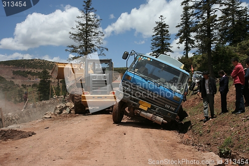 Image of Truck stuck on muddy road