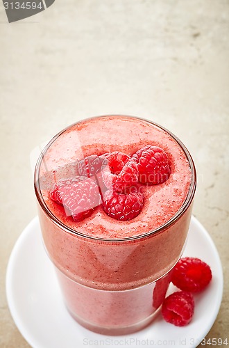 Image of glass of raspberry and banana smoothie
