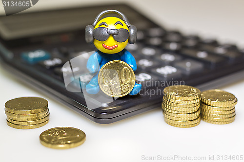 Image of Funny plasticine man with euro coins