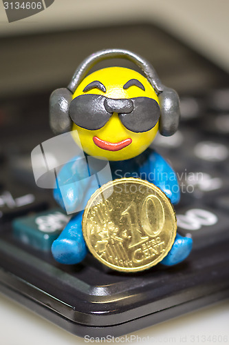 Image of Plasticine man with euro coin