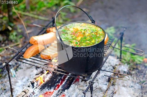 Image of The cooking of soup on the fire