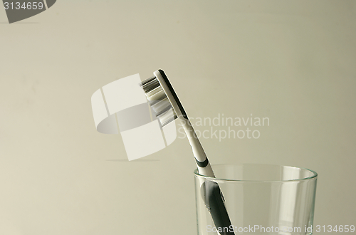 Image of toothbrush in a glas