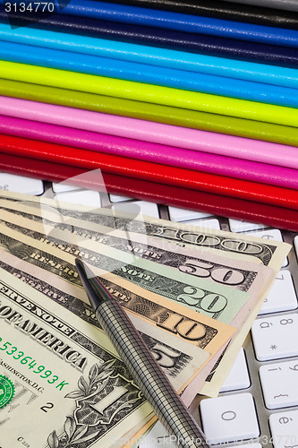 Image of Business desk - Twelve diaries,US dollars,pen and computer