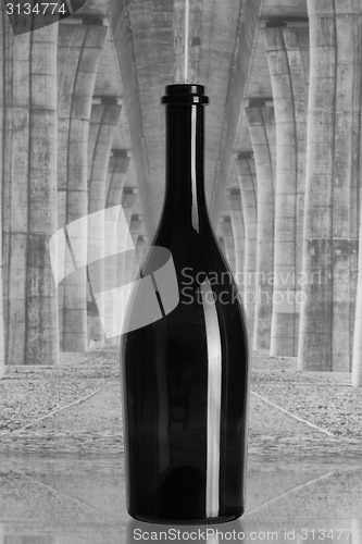 Image of Wine bottle under the highway bridge