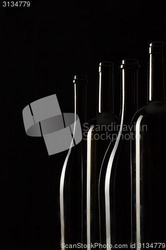 Image of Silhouettes of elegant wine bottles