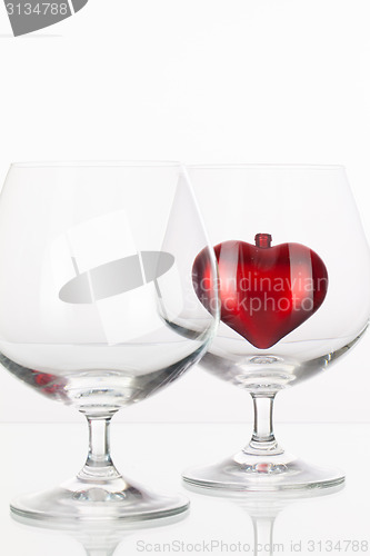Image of Red heart inside a glass of cognac 