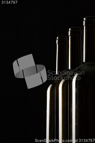 Image of Silhouettes of elegant wine bottles