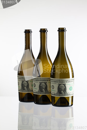 Image of Empty bottles of wine from the label of dollar bill 