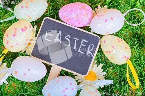 Image of Top view to the easter eggs with chalkboard