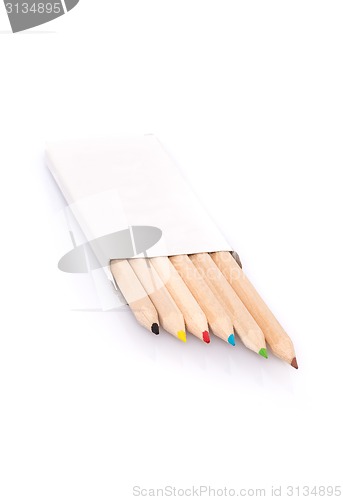 Image of Various color pencils in box on white background