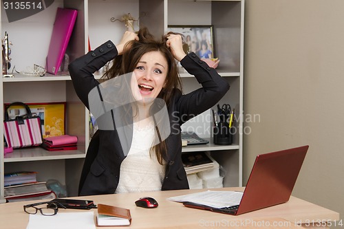 Image of Girl in the office tearing my hair out