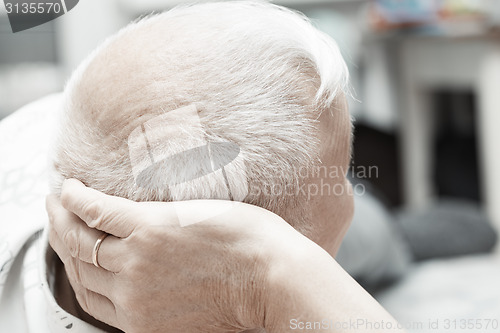 Image of Senior man laying down on the bed