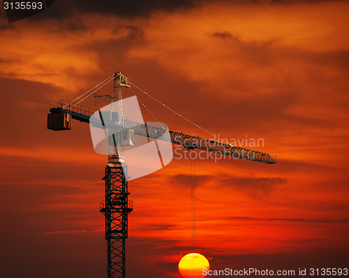 Image of Construction Crane Hoisting the Sun