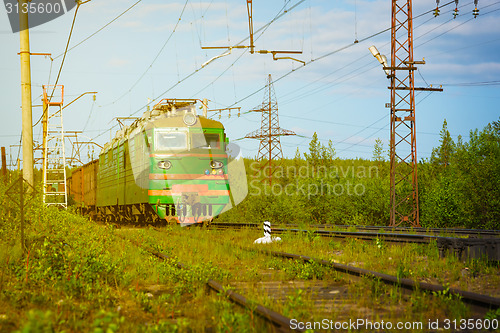 Image of Electric Freight Train Approaching Polyarnye Zori, Russia