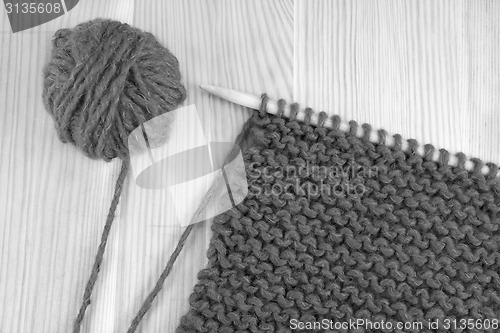 Image of Wool and garter stitch on knitting needle