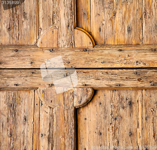 Image of  abstract   rusty brass brown  closed wood lombardy italy   