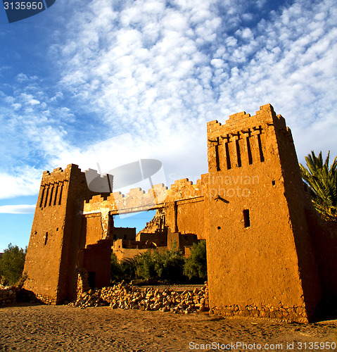 Image of africa  in histoycal maroc  old construction  and the blue cloud