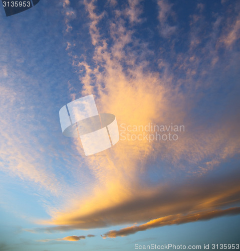 Image of sunrise in the colored sky white soft clouds and abstract backgr