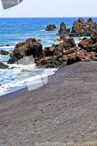 Image of hervideros brown rock in white coast   water   summer 