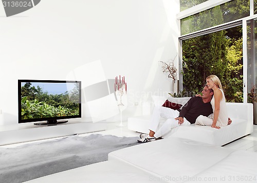 Image of Beautiful Couple Watching TV